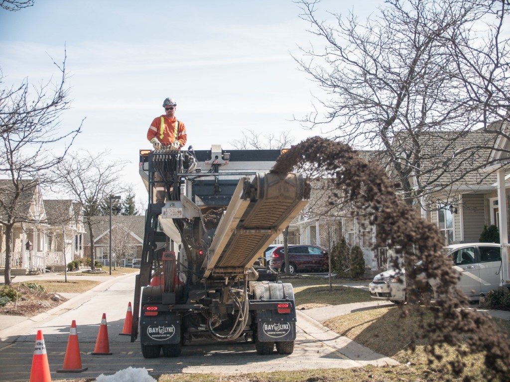 Hydrovac hose positioned over a controlled excavation